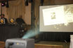 Projector screen showing couples invites being animated with confetti